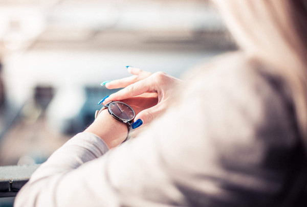 woman-checking-the-time-on-her-fashion-watches-2210x1473[1].jpg